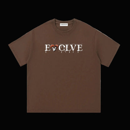 Brown shirt that has white text that says "EVOLVE The universe moves when you finally listen to your soul" on a black background. 