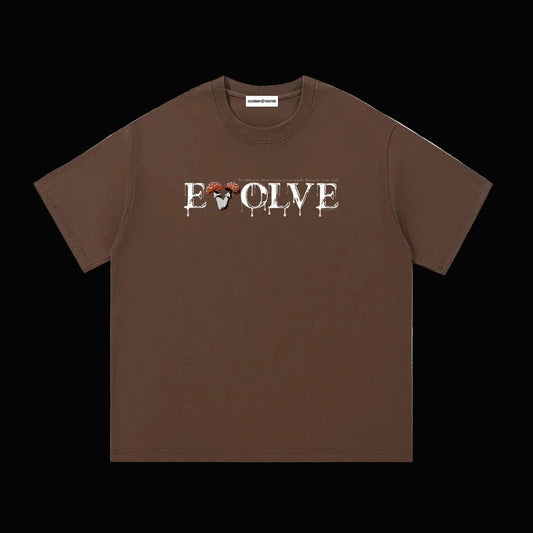 Brown shirt that has white text that says "EVOLVE The universe moves when you finally listen to your soul" on a black background. 